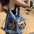 Trendy denim backpack with leather strap detail
