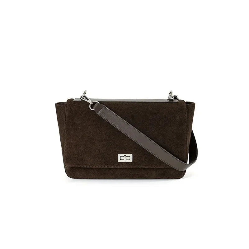 Textured suede handbag with flap closure