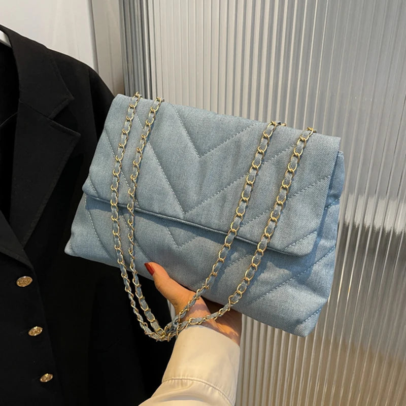 Flap-style denim shoulder handbag
