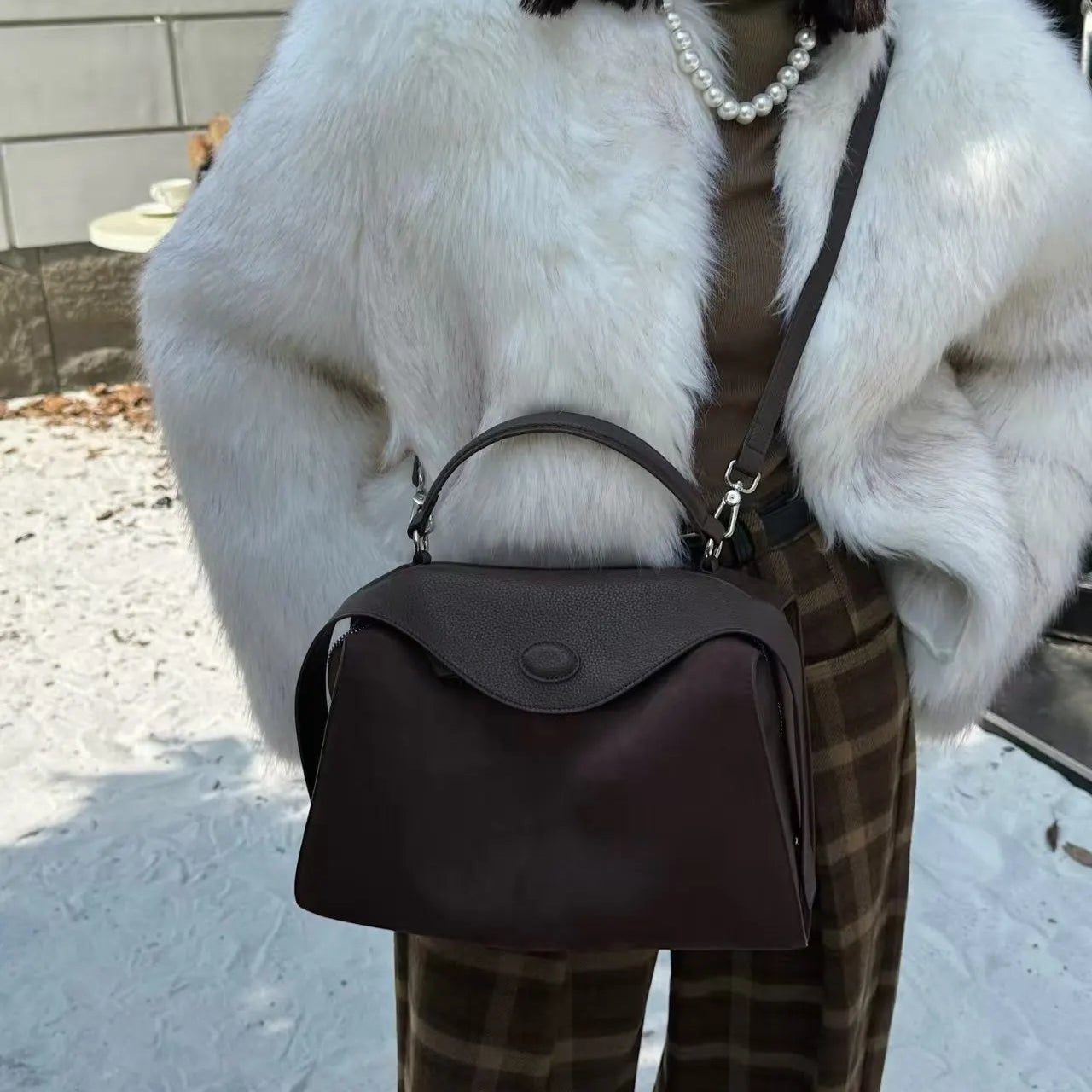 Suede handbag with subtle colors