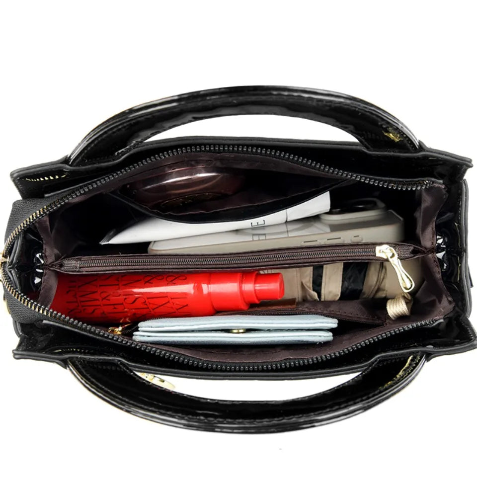 Soft leather handbag with curved top edge
