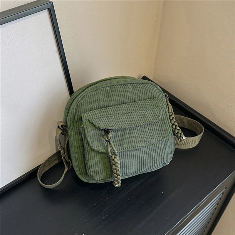 Small corduroy handbag with front zipper pocket