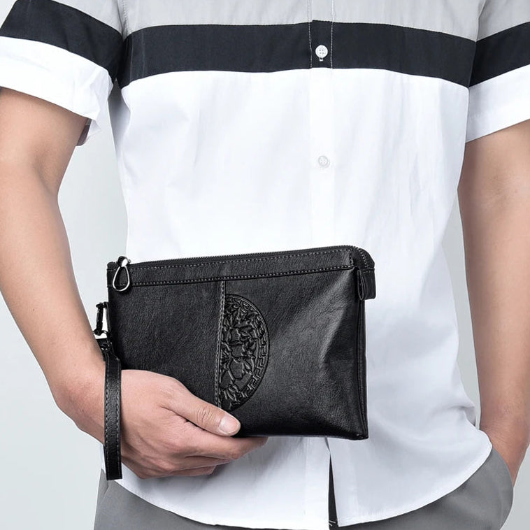 Minimalist leather clutch with detachable strap