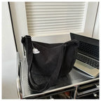 Corduroy handbag with adjustable shoulder strap