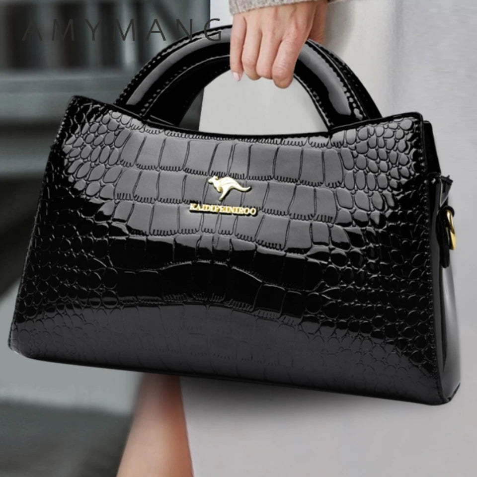 Soft leather handbag with curved top edge