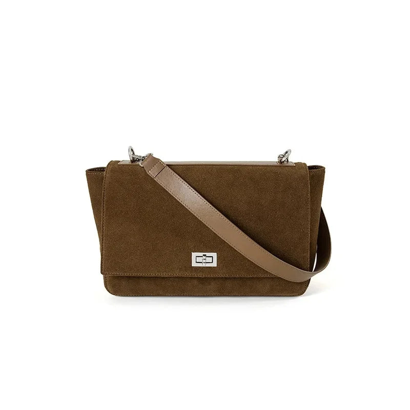 Textured suede handbag with flap closure