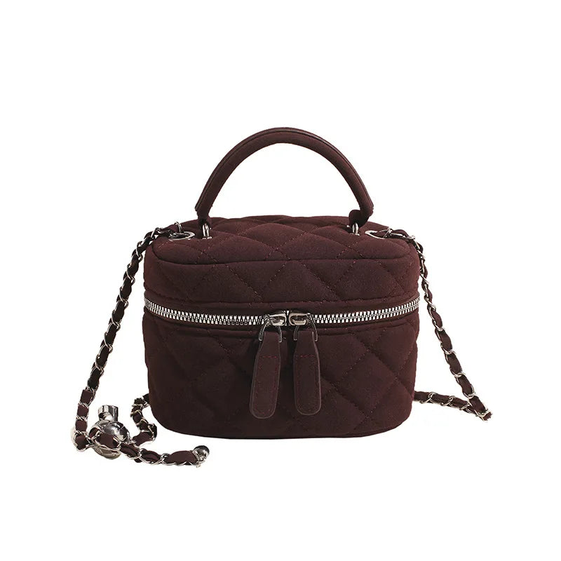 Classic suede handbag with structured handle