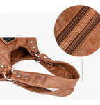 Leather shoulder bag with side pockets
