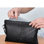 Minimalist leather clutch with detachable strap