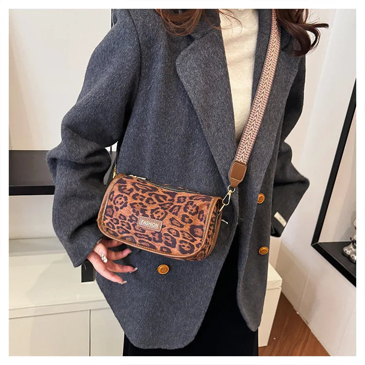 Sleek suede purse with wide shoulder strap