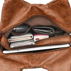 Leather shoulder bag with side pockets