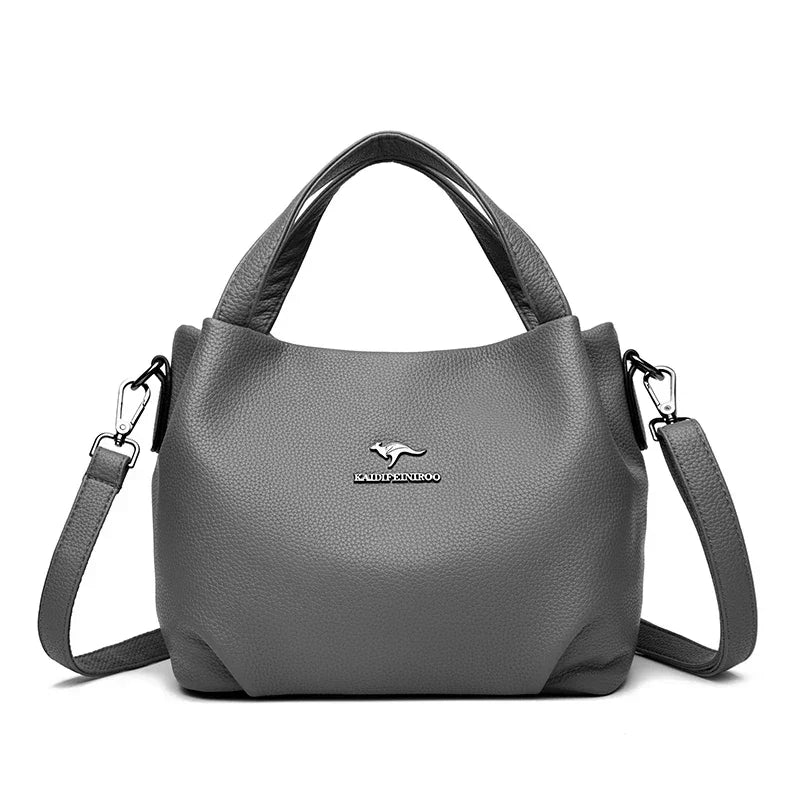 Leather handbag with wide base