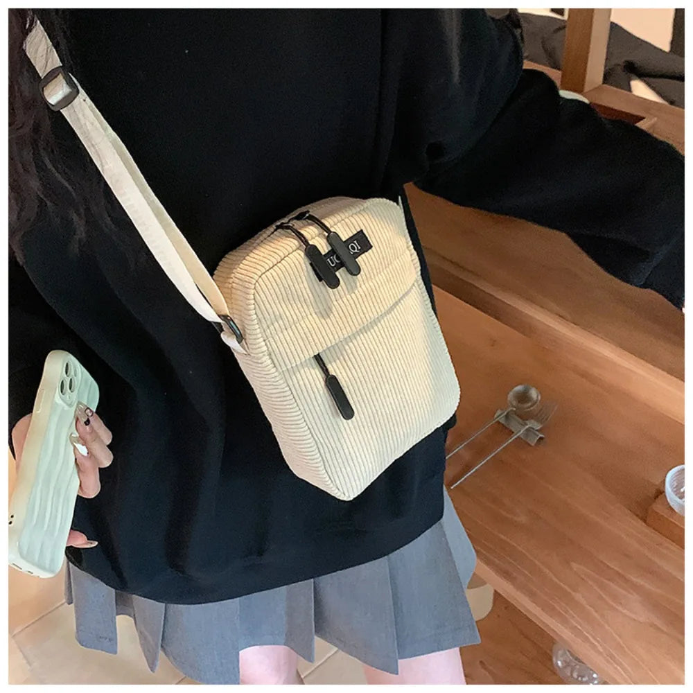 Compact corduroy crossbody bag