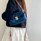 Denim handbag with leather handles