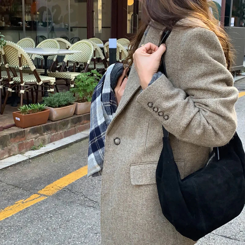 Soft suede slouch bag with single shoulder carry