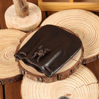 Compact drawstring pouch in leather