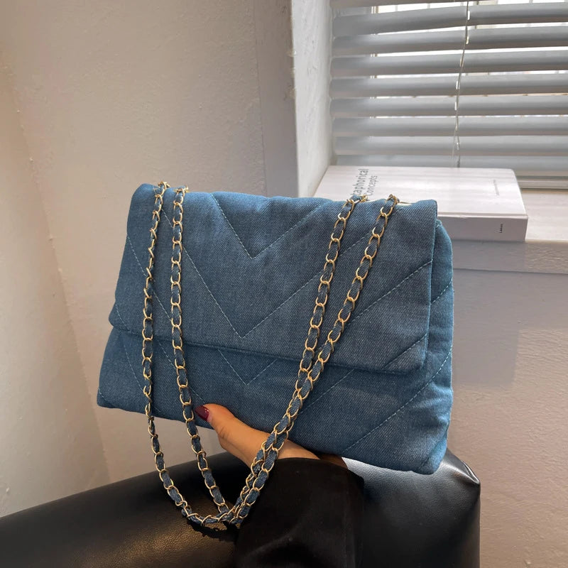 Flap-style denim shoulder handbag