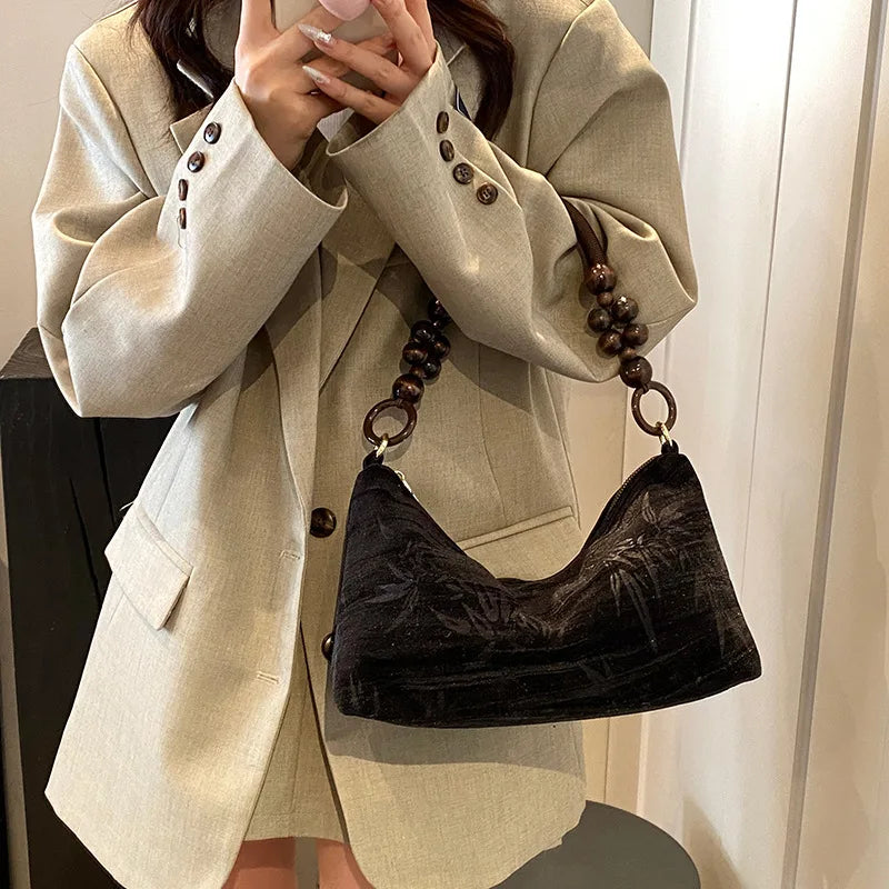 Corduroy handbag with wooden bead handle