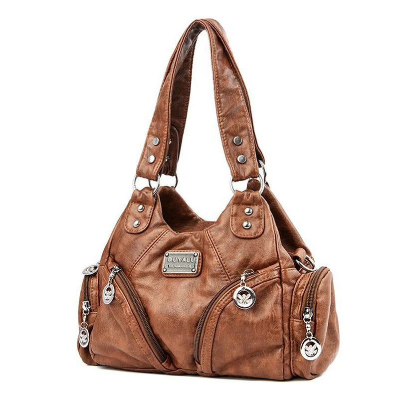 Leather shoulder bag with side pockets