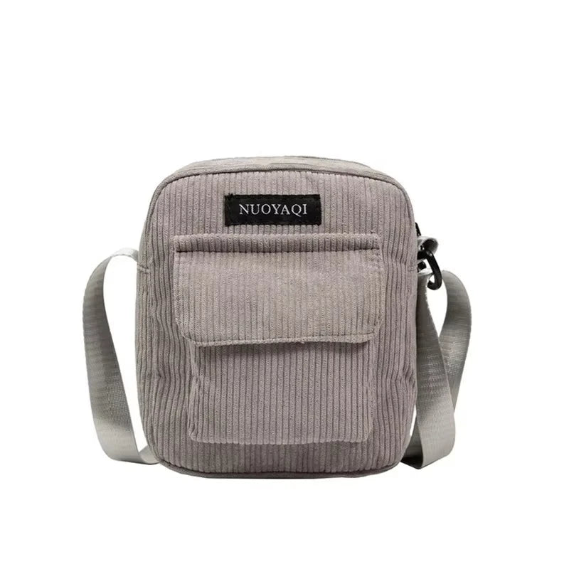 Corduroy crossbody handbag with front pocket