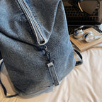 Washed denim backpack with adjustable straps