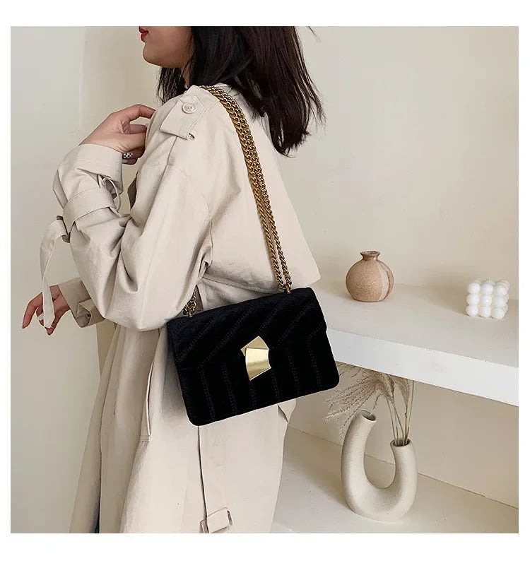 Corduroy handbag with chain and flap closure