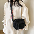 Small corduroy handbag with front zipper pocket