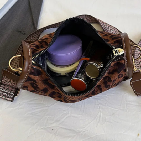 Sleek suede purse with wide shoulder strap