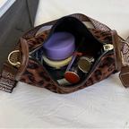 Sleek suede purse with wide shoulder strap