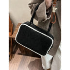 Elegant suede handbag with vintage charm