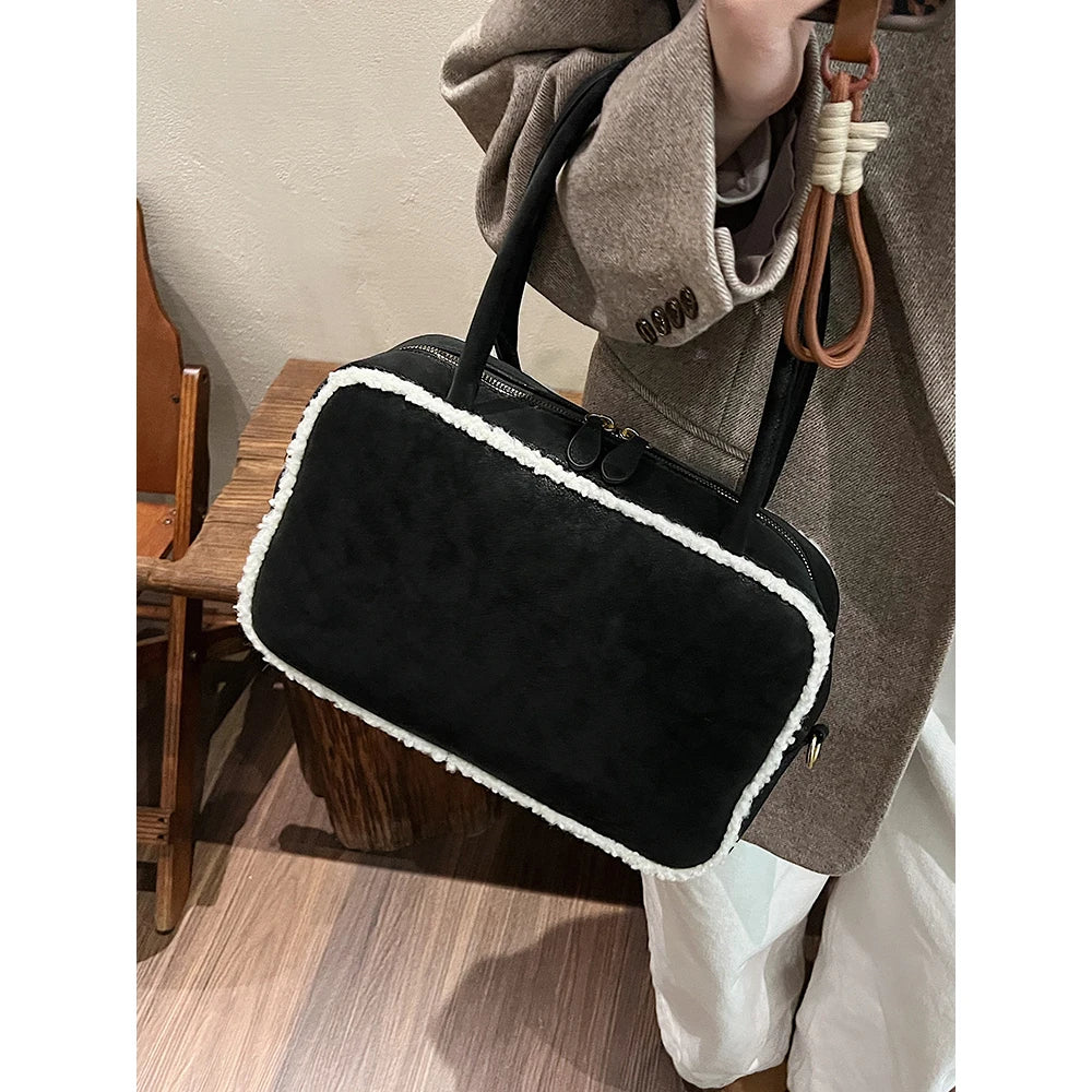 Elegant suede handbag with vintage charm