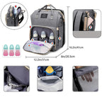 Blue diaper backpack with built-in bed
