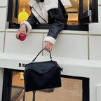 Suede handbag with subtle colors