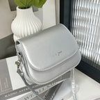 Compact leather sling crossbody