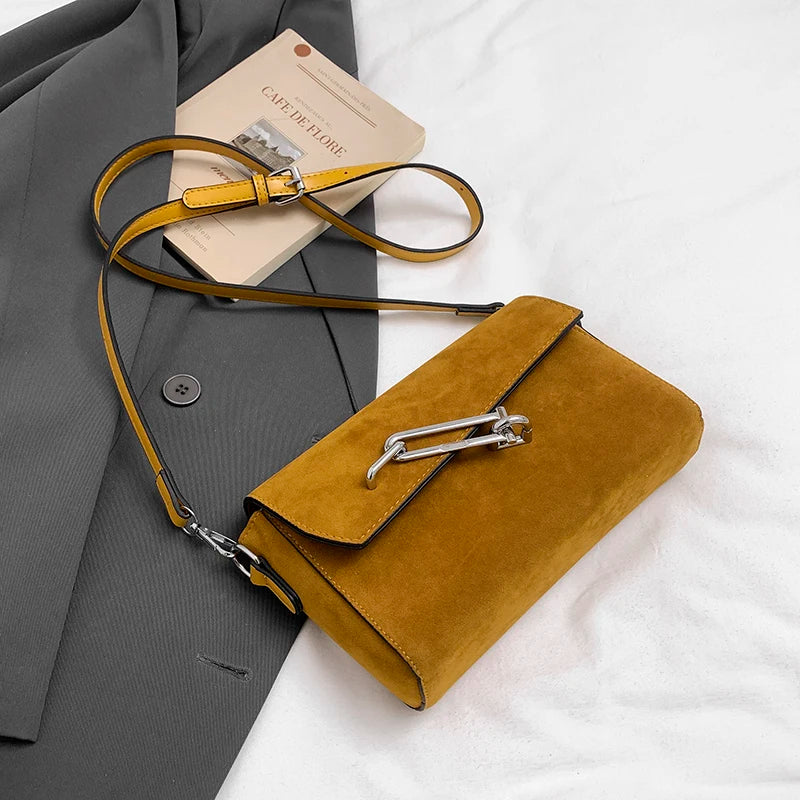 Structured suede handbag with minimalist shape