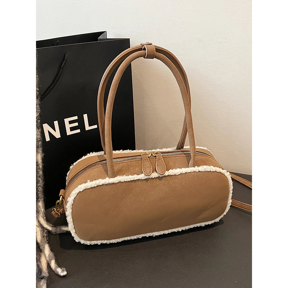 Elegant suede handbag with vintage charm