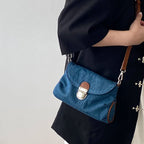 Denim handbag with leather handles