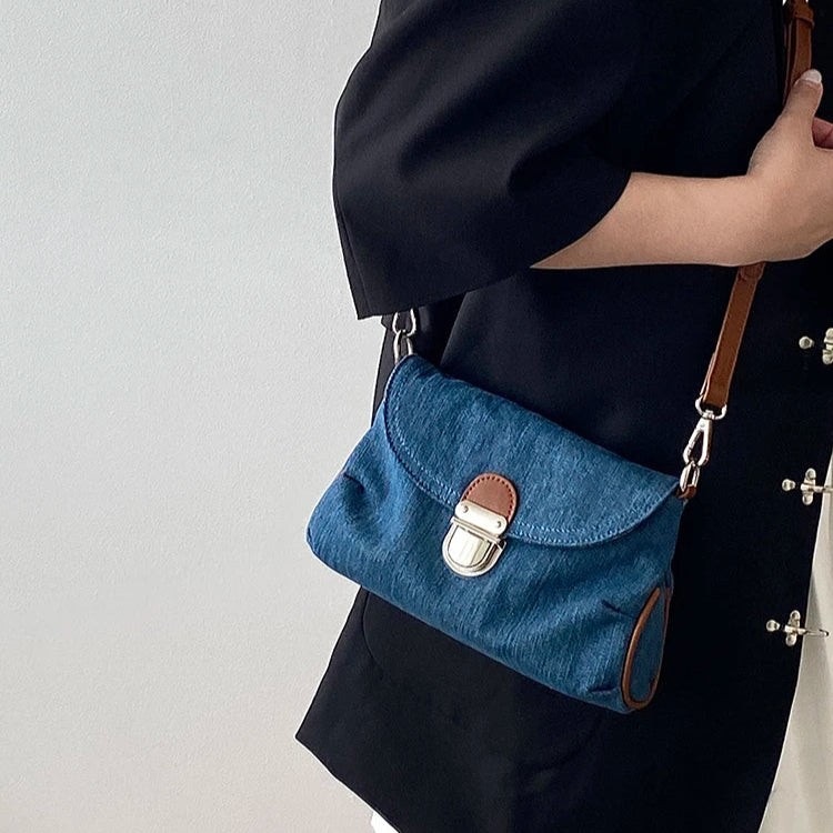 Denim handbag with leather handles