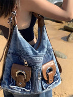 Trendy denim backpack with leather strap detail