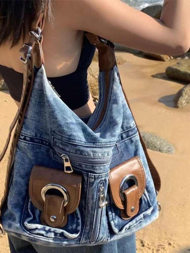 Trendy denim backpack with leather strap detail