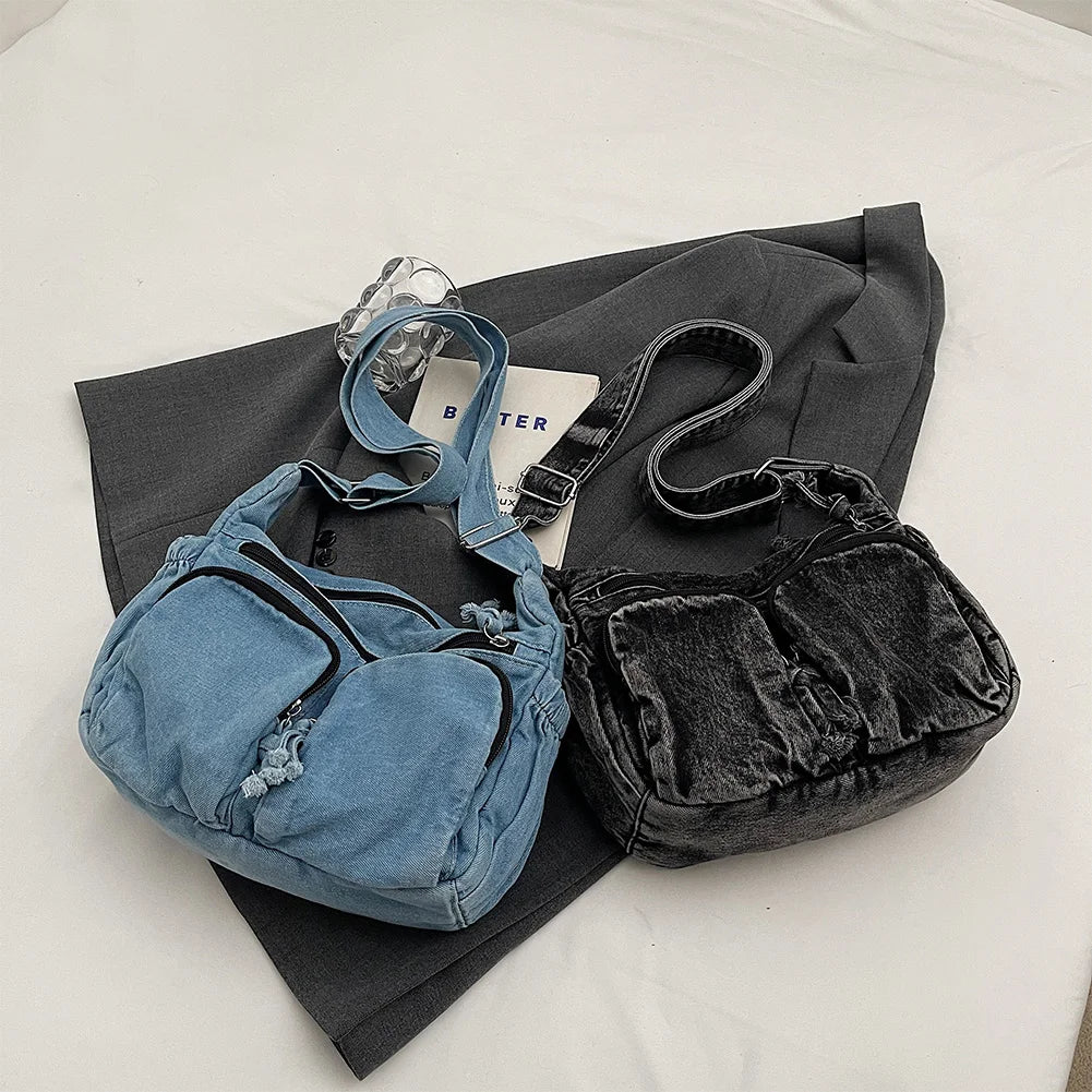 Denim shoulder bag with front pockets and buckle strap