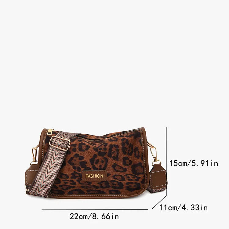 Sleek suede purse with wide shoulder strap