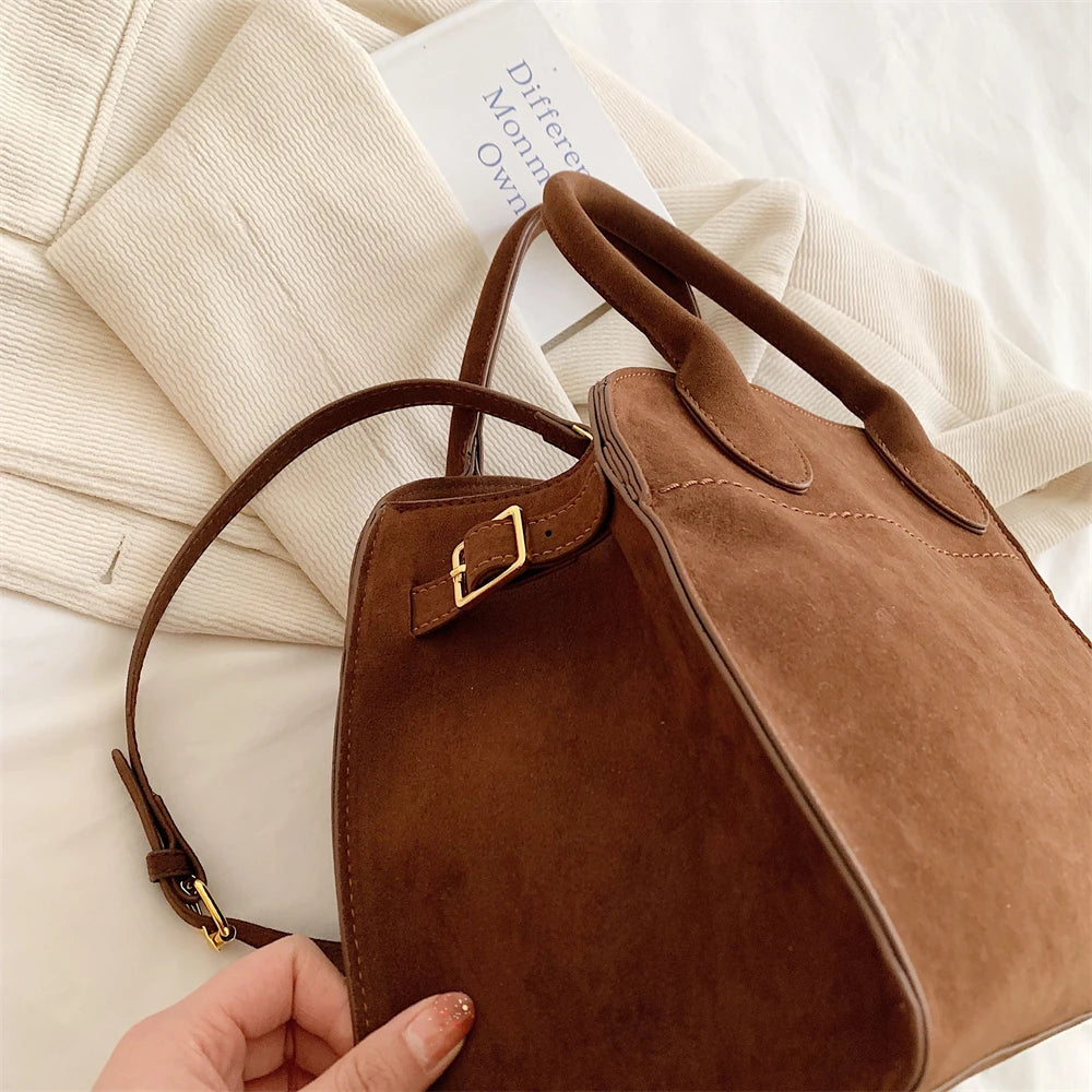 Suede handbag with shoulder strap
