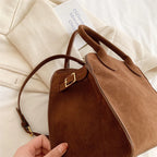 Suede handbag with shoulder strap