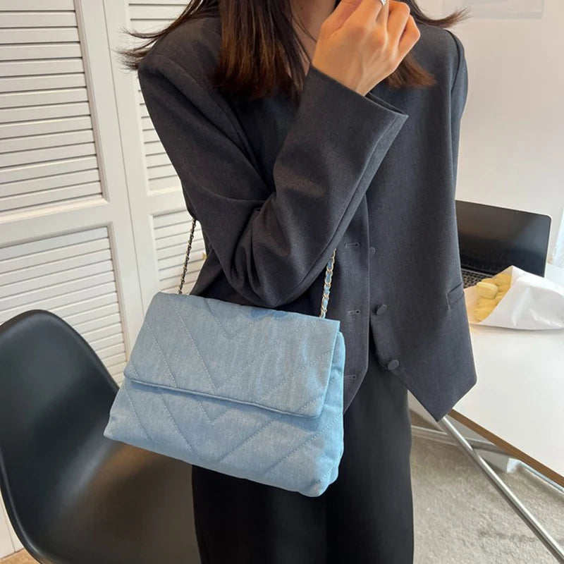 Flap-style denim shoulder handbag