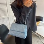 Flap-style denim shoulder handbag