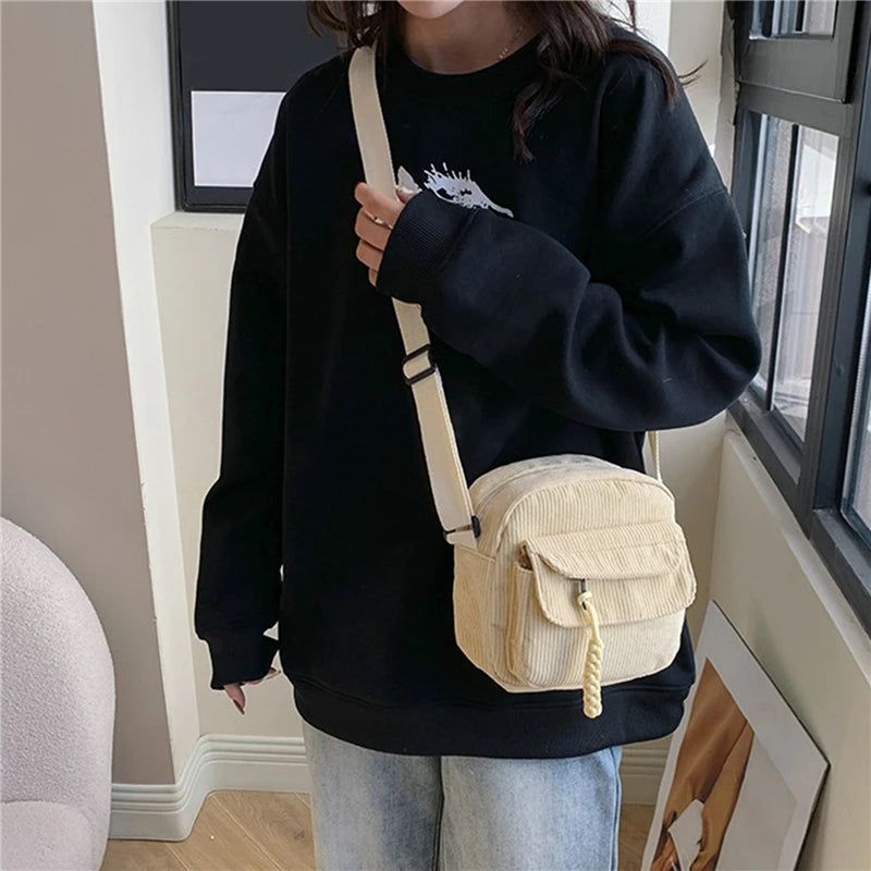 Small corduroy handbag with front zipper pocket