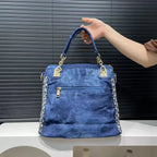 Elegant floral embroidered denim handbag with chain handle