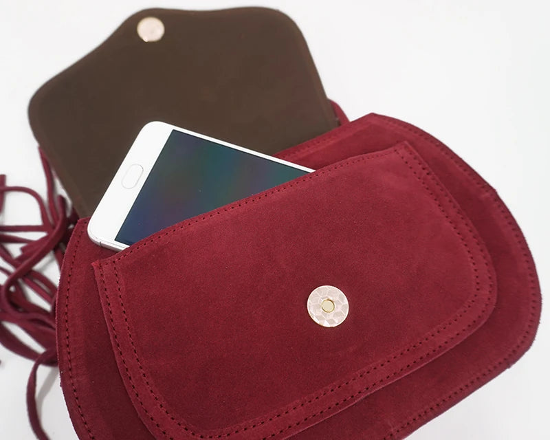 Fold-over suede shoulder bag