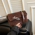 Structured suede handbag with minimalist shape